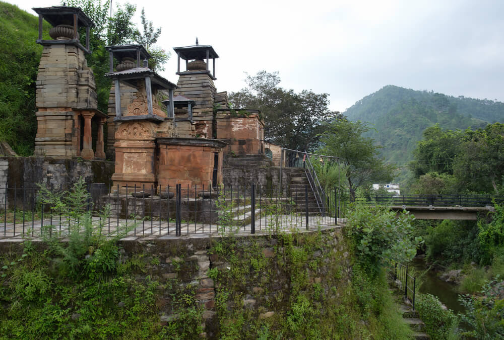 Trinetra Mahadeva Temples next to a mountain stream