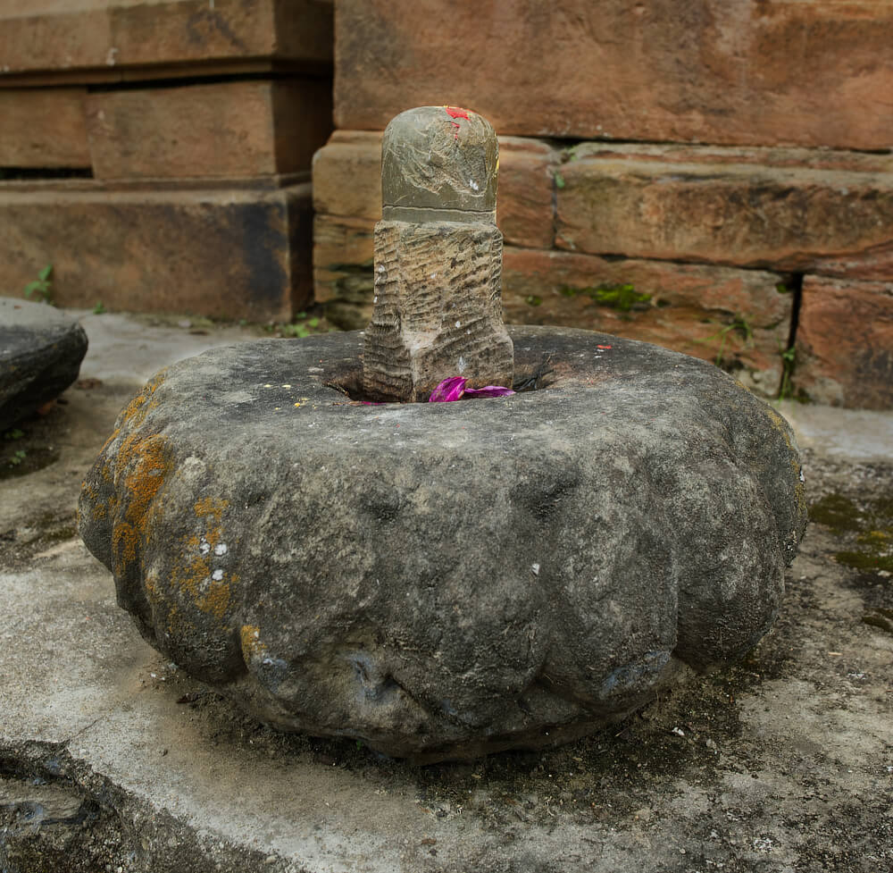 Stone from top of a temple, with a shivling