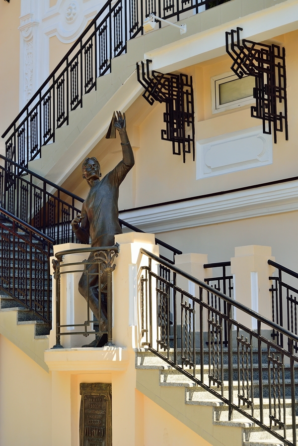 Wrought iron railing with statue