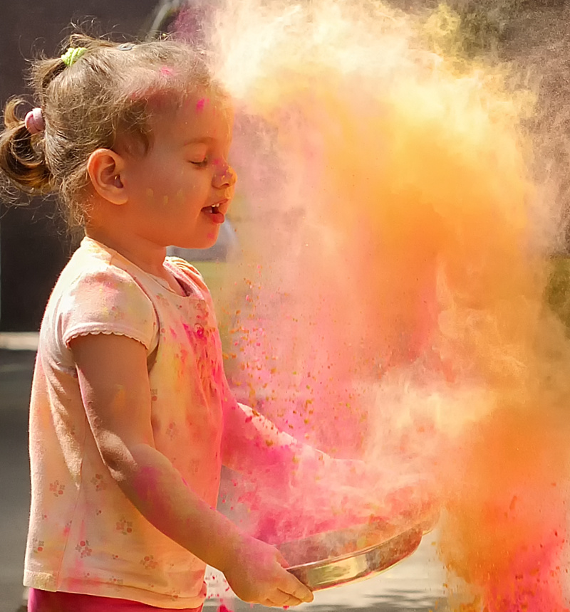 Kid playing with Holi Colors