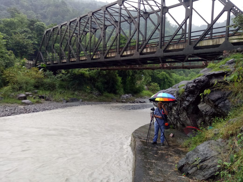 Standing under the umbrella